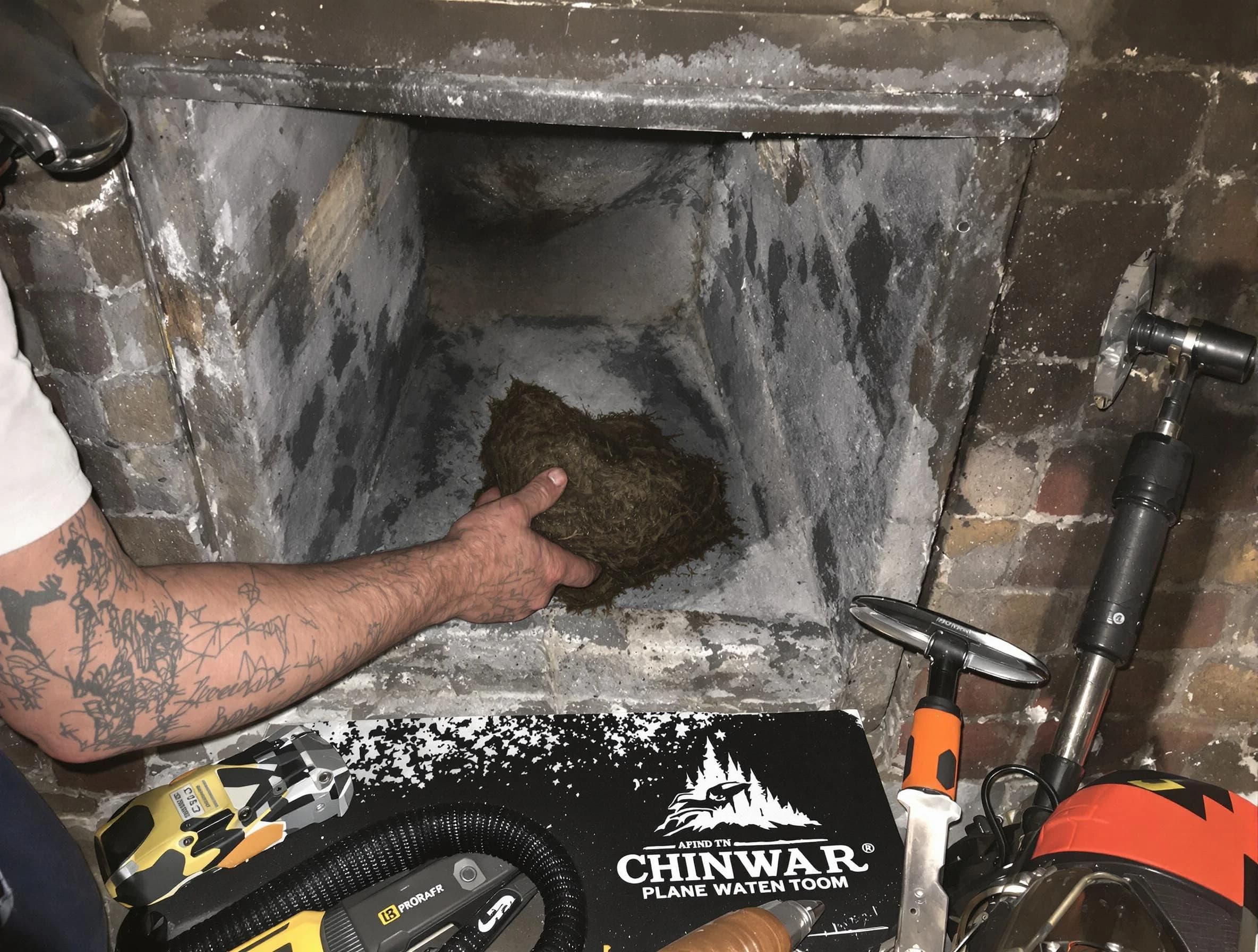 Munhall Chimney Sweep safely removing debris and screening chimney in Munhall, PA